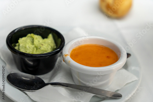 Lanzarote island  Canary Islands pdish Papas Arrugadas ( wrinkly potatoes) with Mojo picon (Red hot sauce) and Mojo verde ( Green sauce) on restaurant table
