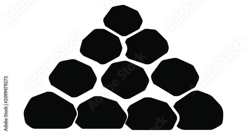 Billede på lærred Black silhouette of stacked stones forming a pyramid like structure
