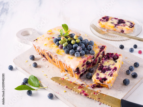 Homemade blueberry lemon loaf cake with fresh homegrown blueberries; copy space