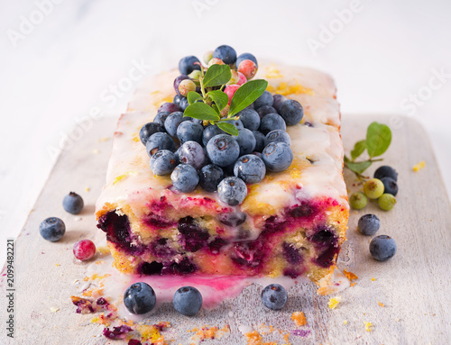 Homemade blueberry lemon loaf cake with fresh homegrown blueberries; copy space