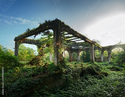 overgrown ruins of a modernist architectural structure showing the passage of time and nature s reclamation