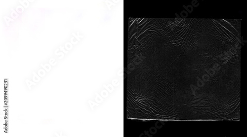 Foto Transparent plastic wrap texture on black background, wrinkled cellophane overla