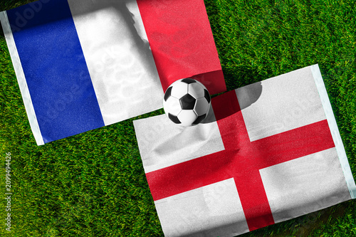Fotografie France vs England, Third place match, national flags before international football match, football on green grass with stadium in the background, Miami Gardens, July 18, 2026