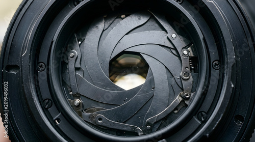 Close-up of a camera lens aperture with a detailed view of the blades, aperture