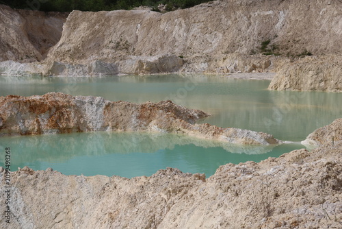 Close-up of turquoise quarry water and white mineral formations