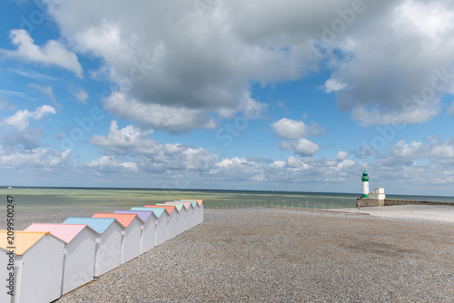 Obraz na płótnie Views of ocean beach and colourful beach huts or cabins in Le Treport, seaside r