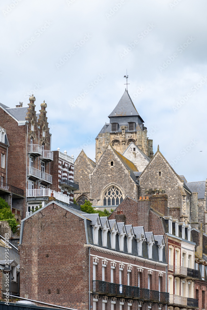 Fototapeta premium Views of Le Treport, seaside resort in Normandy, France, with white cliffs along English Channel, fishing industry and old buildings, travel destination in France