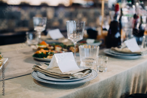 Elegant table setting with blank place card ready for guests