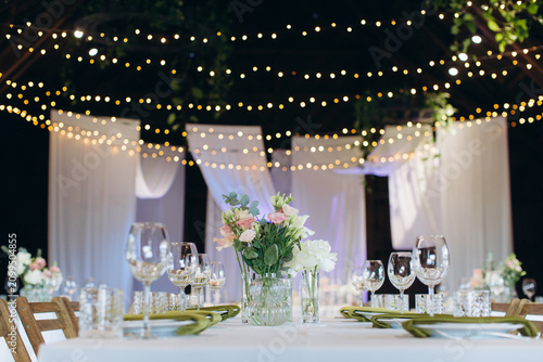 Canvas Print Elegant wedding reception table setting with string lights