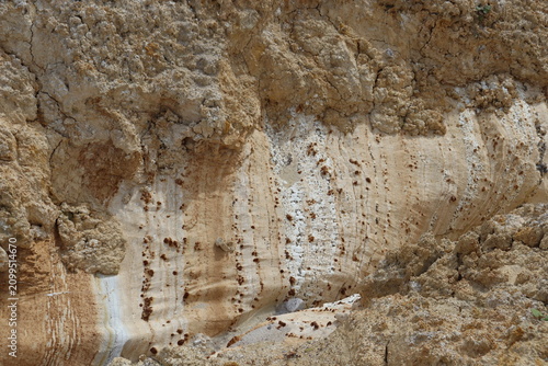 Natural kaolin rock formation with layered mineral texture