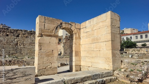 Athens, Greece - 22 June 2026. Limestone doorway and rounded arch of the Early Christian Tetraconch, Basilica of Megali Panagia, beside Hadrian's Library, with excavated foundations, masonry, and near