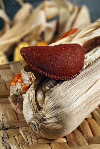 Bild auf Leinwand Cornmeal mush pastry served on ears of corn of various colors.