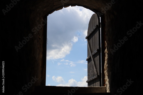 View from medieval underground passage to blue sky