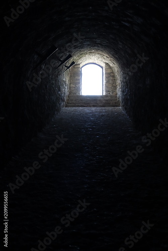 Medieval underground tunnel leading to fortress exit