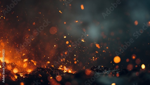 Close-up of fiery embers and sparks rising against a dark, smokey backdrop, creating a dynamic and volatile scene