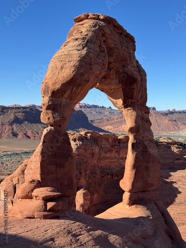 Delicate Arch seen from the north side showing its slender legs and heavy span in Arches National Park Utah