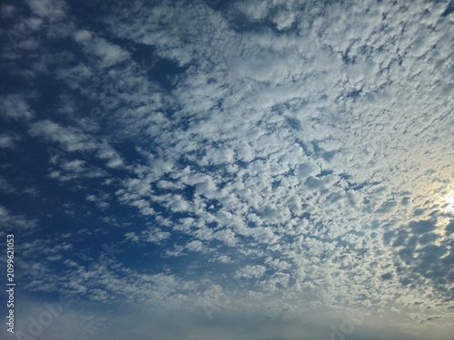 Obraz na plátně Beautiful Altocumulus Cloud Pattern in Blue Sky