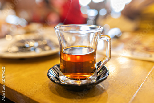 Traditional Turkish tea in glass cup on restaurant table
