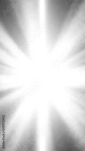 Bright white light rays burst from a central glowing core