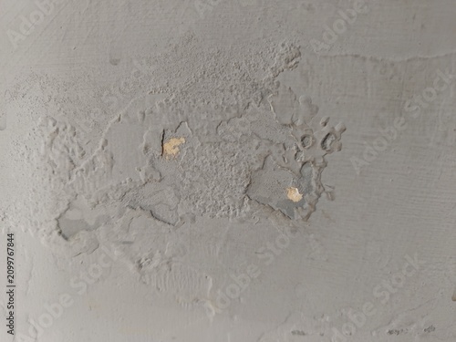 Quadro su tela Close up of peeling and flaking grey paint on a wall caused by dampness and wate