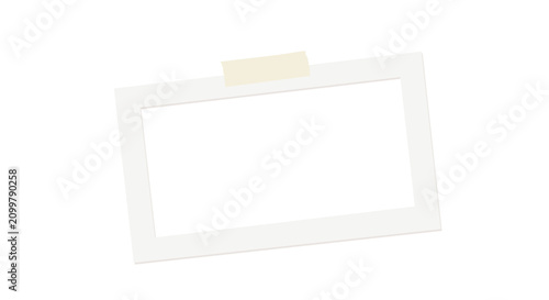 A white Polaroid photo frame with a small piece of tape on top picture blank
