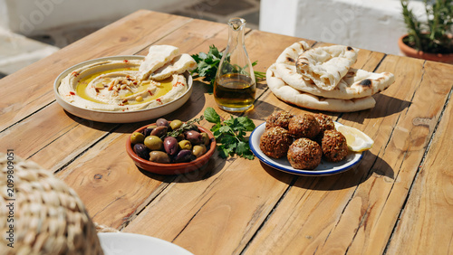 Fresh Mediterranean mezze platter with hummus falafel and pita bread