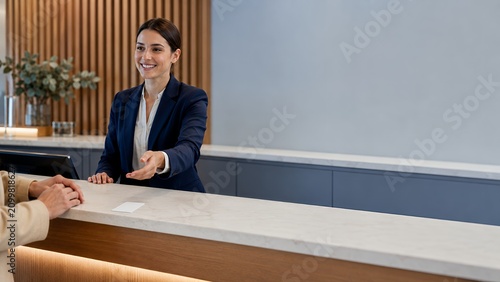 Professional Receptionist: Warm Welcome at Modern Office Front Desk