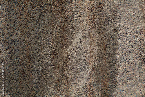 Abstract brown concrete texture with stained surface.
