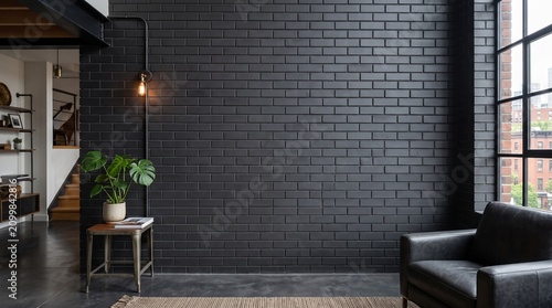 Modern black brick wall interior. Dark industrial loft background with empty copy space.