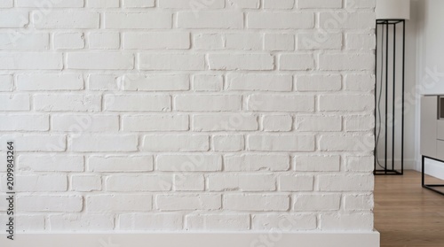 White brick wall texture background. Modern interior design with painted masonry surface.
