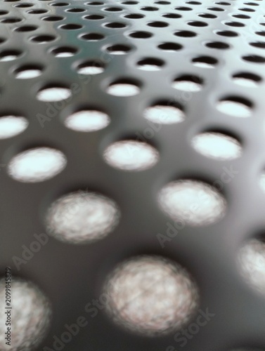 Принти на полотні Perforated Black Metal Sheet Surface Background Texture