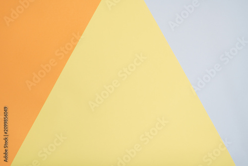 Abstract Background with Geometric Triangles in Orange, Yellow, and Light Grey