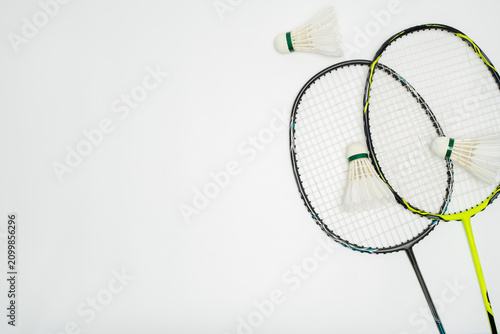 Overhead Shot of Badminton Rackets and Shuttlecocks on White Background
