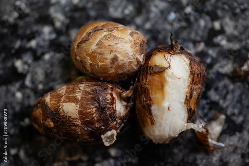Boiled taro roots on black marble countertop