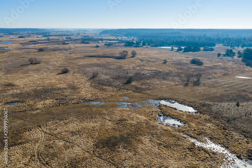 Narew river valley landscape with melting snow in early spring