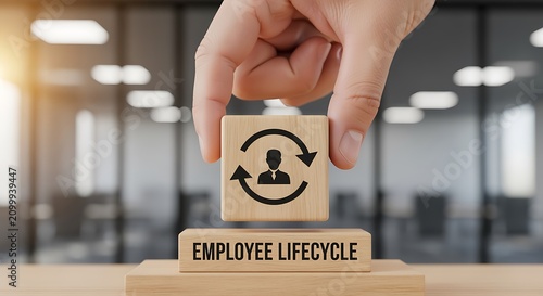 Employee Lifecycle Management Concept with a Wooden Block in Office