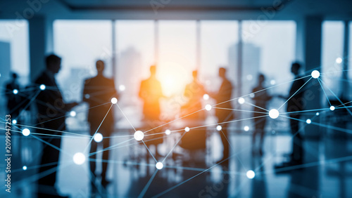 Blurred silhouettes of business people in a modern office with a glowing network overlay, ideal for corporate presentations, technology solutions and team collaboration concepts