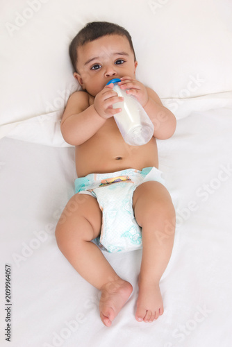 Portrait of baby drinking milk