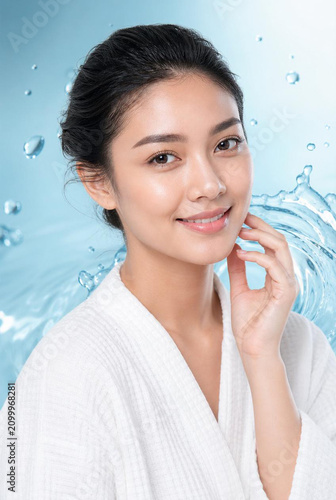 Beautiful Young Asian Woman Touching Her Glowing Face with Water Splashes, Skincare and Facial Hydration Concept, Generative AI