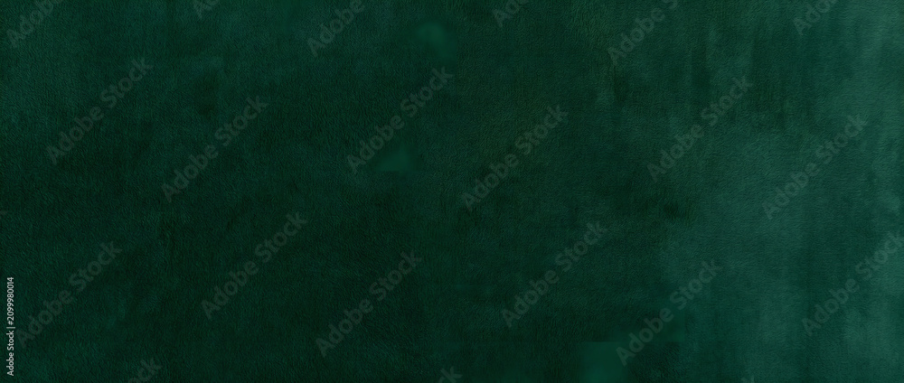 Fototapeta premium Green texture background featuring a richly grained deep emerald surface with soft brush strokes and subtle shading for elegant designs