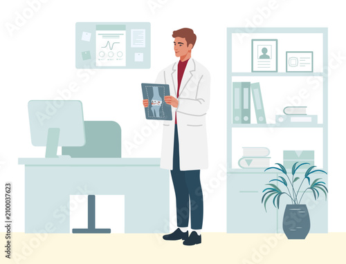 Male doctor analyzing x-ray in modern office with computer and shelves in the background