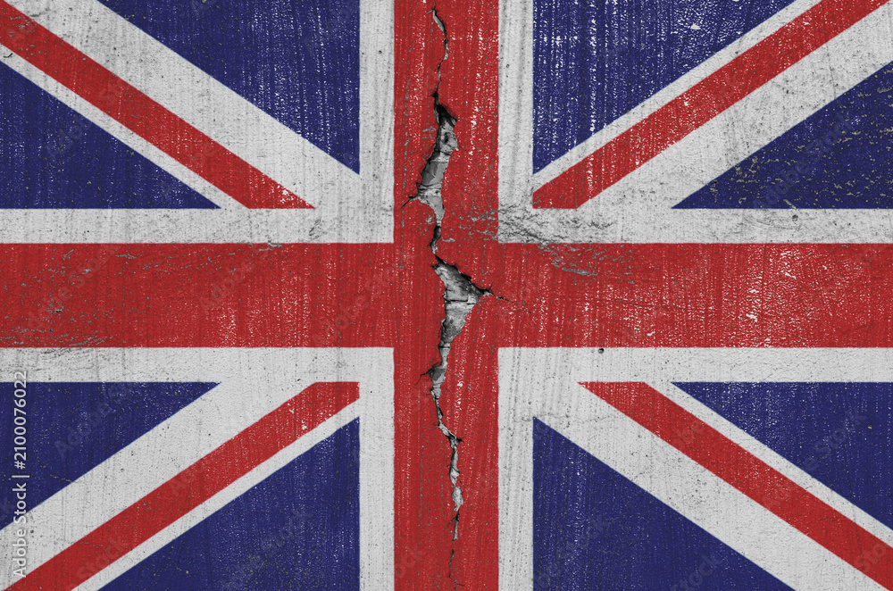 Fototapeta premium British Union Jack flag are painted on an old wall with a cracked