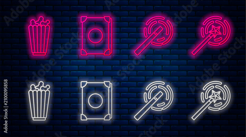Set line Ancient magic book, Magic wand, Popcorn in box and Magic wand. Glowing neon icon on brick wall. Vector