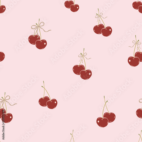 Cute cherries with bows pink background seamless fabric design pattern