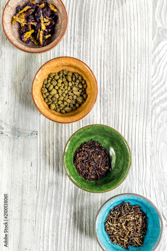 Quadro su tela Drink herbal tea with brew gray wooden table background top view