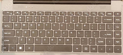 Konstfotografi Top down view of a dark grey laptop keyboard featuring standard qwerty layout wi