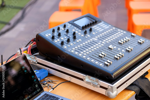 Obraz na plátne Audio mixer soundboard with laptop for outdoor event music production setup