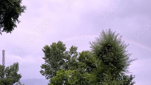 Beautiful Rainbow After Rain Over Scenic Landscape with Colorful Sky, Fresh Atmosphere, Natural Beauty and Peaceful Countryside View Experience