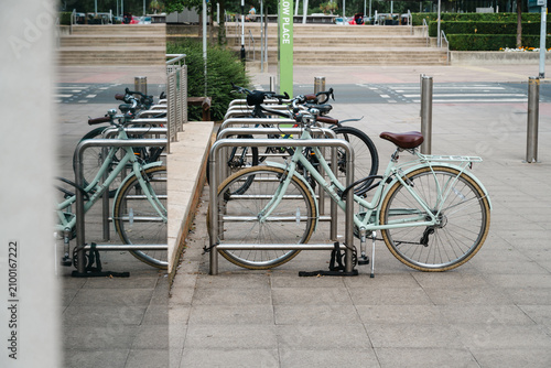 Corby, Northamptonshire, United Kingdom - July 15, 2026: Bicycles parked at modern bike rack in urban city center