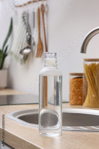 Clear glass water bottle fi...